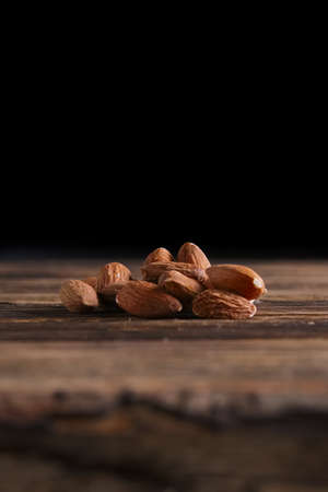 Almonds on the wooden backgroundの写真素材