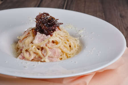 pasta with ham and cheese with caramel onionの写真素材