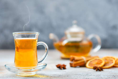 Hot citrus tea with cinnamon and anise (soft focus photo with shallow depth of field)の写真素材