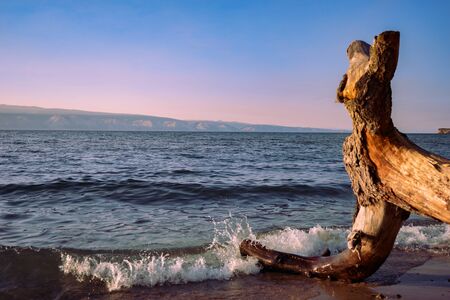 Beautiful and colorful sunset over the baikal lake, Russiaの写真素材