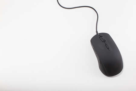 Isolated black computer mouse on white backgroundの写真素材