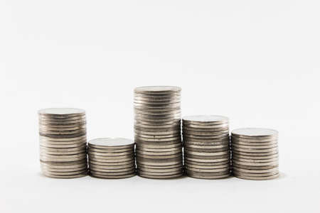 Isolated Thai coin stacks on white backgroundの写真素材