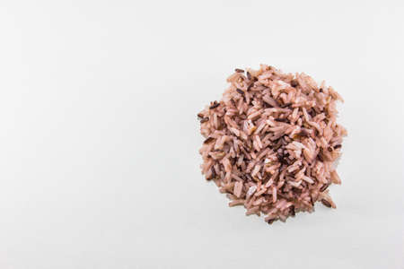 Isolated cooked mix riceberry and jasmine rice on white background
