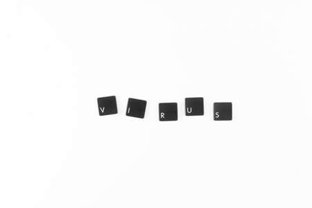 Virus word written with black computer keyboard keys の写真素材