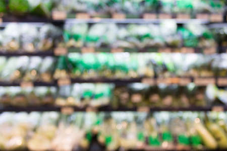 Abstract blur interior vegetables shelves at supermarket in shopping mall for backgroundの写真素材