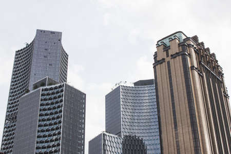 Bottom view of modern building in business district on white backgroundの写真素材