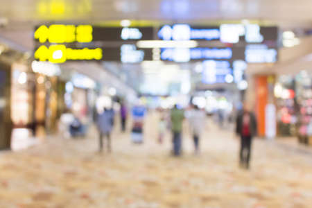 Abstract blur duty free area in airport with people for backgroundの写真素材