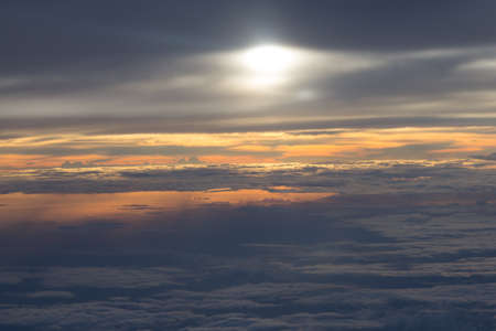 View of sunset and cloud from airplane windowの写真素材