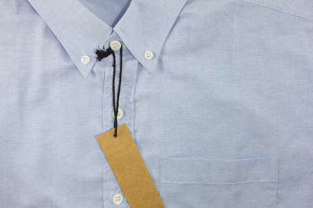 brown blank price tag on formal shirtの写真素材