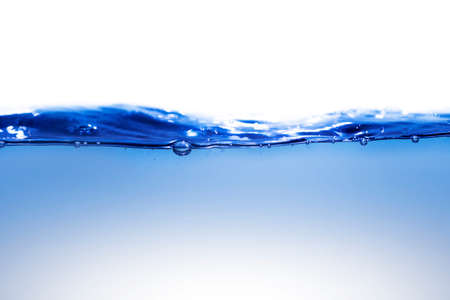 Clean water with water droplets and wavesの写真素材