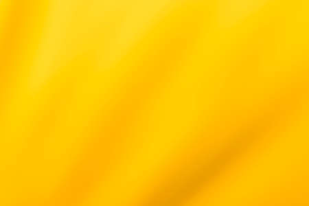 Orange yellow cotton fabric for a soft and smooth background. Elegant graphics.の写真素材
