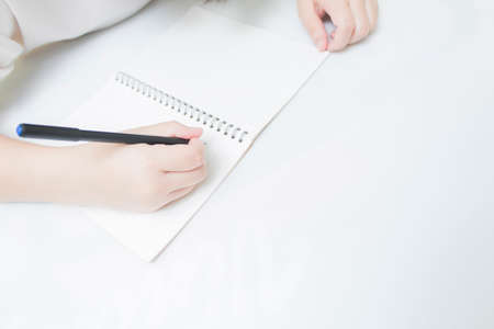 Close-up concept of pen writing notebook isolated on white background