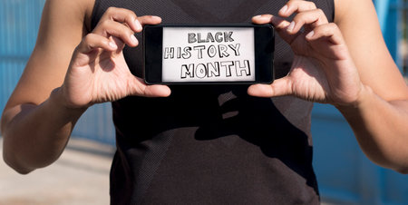 Black history month celebrates print on smartphone.の写真素材