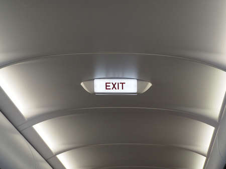 Emergency exit sign on plane