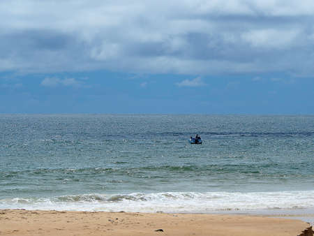 oft ocean wave on sandy beach backgroundの写真素材