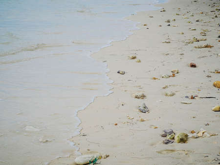 Soft ocean wave on sandy beach backgroundの写真素材