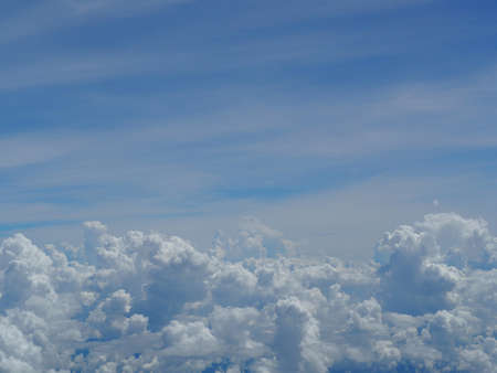 Blue sky background with cloudsの写真素材