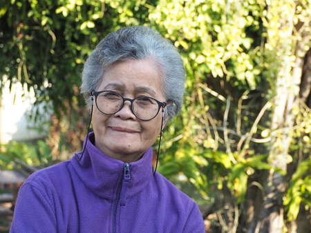 Portrait of a elderly woman smile in the garden.