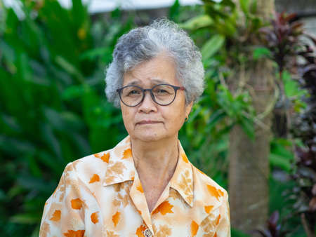 Portrait of senior woman asian in the garden.