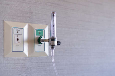 Oxygen for patients installed in the wall in room at the hospital. Space for text. Medical equipment and health care conceptの写真素材