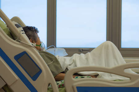 Close up of elderly woman patients with lung disease, getting oxygen for treatment in the room at hospital. Space for text. Health care conceptの写真素材