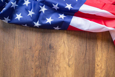 Top view of American flag on wooden background with copy space for text. 4th of july Independence...