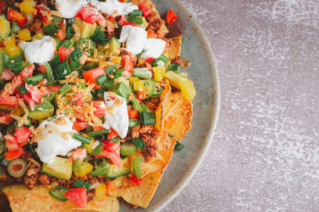 Top view of loaded minced pork nachos. Space for text. Concept of Mexican foodの写真素材