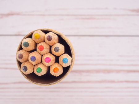 Top view set of colored pencils on wooden table. Close-up photo. Space for text.の写真素材