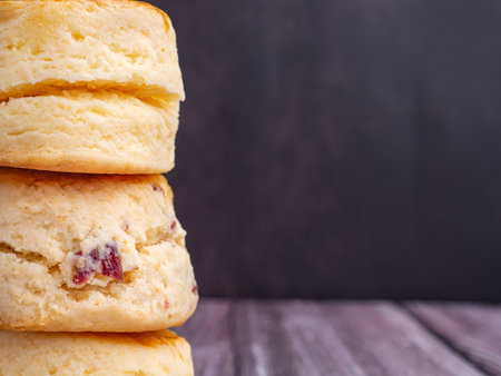 Scones traditional English delicious fresh homemade with dark vintage wall background. Close-up...
