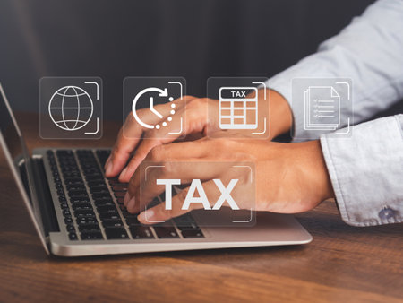 Tax payment and Calculation tax return concept. Businessman using a laptop to complete Individual...