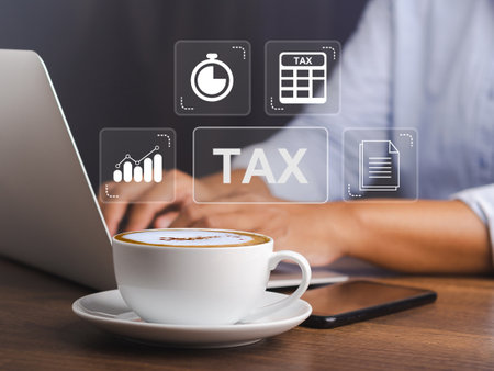 Tax payment and Calculation tax return concept. Businessman using a laptop to complete Individual income tax return form online for tax payment. Taxes paid by individuals and corporationsの写真素材