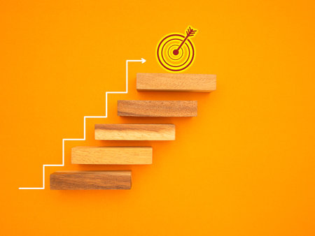 Business growth and investment concept. Wooden blocks stair with white line effect isolated on a yellow background for connecting to goal successの写真素材