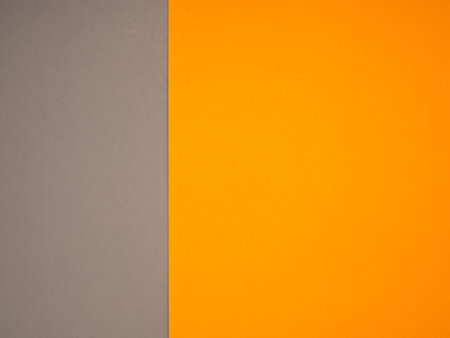 Gray and an orange paper color for the background. Space for text. Top viewの写真素材