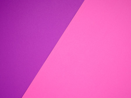 Purple and a pink paper color for the background. Space for text. Top viewの写真素材