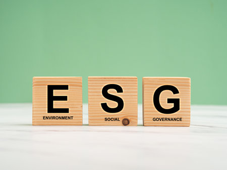 ESG concept of environmental, social, and governance. Wooden cubes with the letters ESG over a...