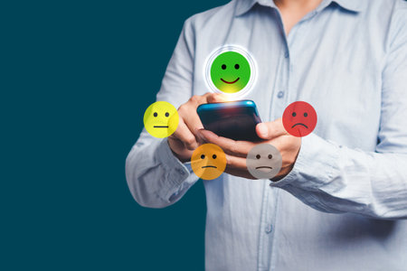 Positive feedback concept. Choosing a green happy mood icon rating review in the survey, poll, or customer satisfaction research on a virtual screen. Sad and happy mood icons. Feedback emotion scaleの写真素材