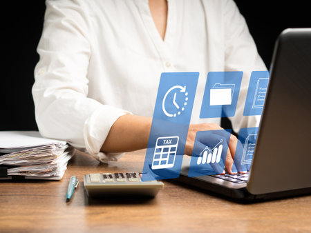 Time for taxes money financial accounting taxation concept. A businesswoman uses a tax form to complete an individual income tax payment form. Tax payment and calculation tax returnの写真素材
