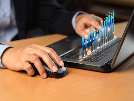 Business person analyzing financial report on a virtual screen. Screen with charts and diagrams.Chart graph elements for data analytics. Business and marketing research evaluation performanceの写真素材
