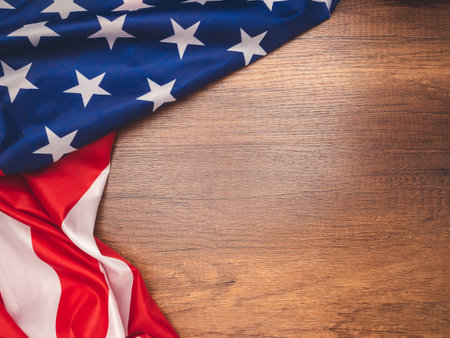Top view of the American flag on a wooden table with copy space for text. Top view. Close-up photoの写真素材