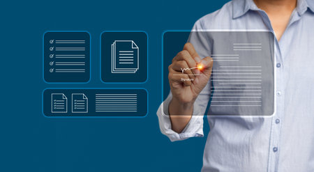 Electronic signature concept. A businessman uses a pen to sign documents on a virtual screen while...