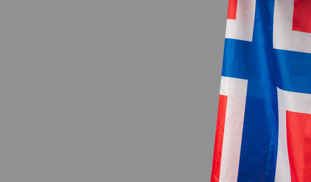 Side view of the Norway flag on a gray background. Space for text Top view. Close-up photo