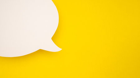 A blank white speech bubble part over a yellow background. A speech bubble concept. Space for text....