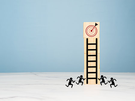 Business growth concept. Wooden cubes with black stairs aim in a dartboard icon over a marble floor with a blue background. Focus on a goal and achieve a successful businessの写真素材