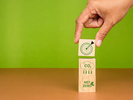 Net-zero emissions in 2050. Save the earth and environment, and be carbon neutral. Wooden cubes with...