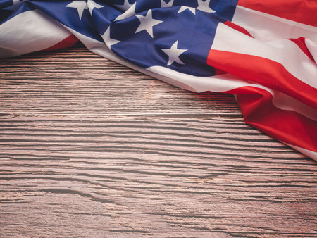 The American flag is on a wooden table with copy space for text. Top view. Close-up photoの写真素材