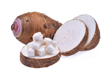 fresh taro with cubes and slice isolated on white backgroundの写真素材