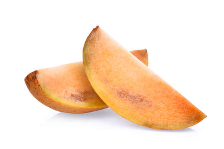 slice of fresh sapodilla fruit isolated on white backgroundの写真素材