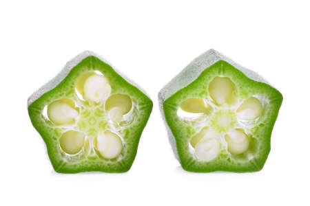 two slice of fresh green okra isolated on white backgroundの写真素材