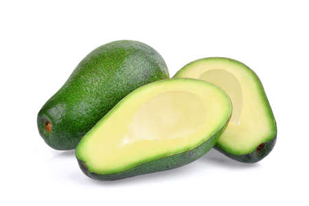 fresh whole and half avocado isolated on white backgroundの写真素材