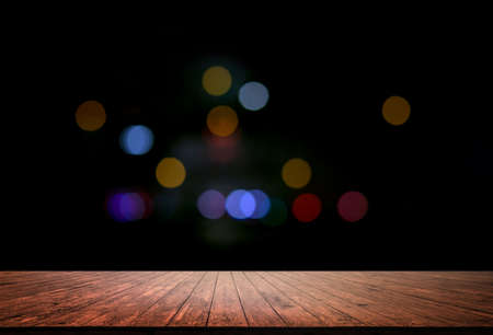 empty wood plank floor mock on the bokeh night background for display or montage your work backgroundの写真素材